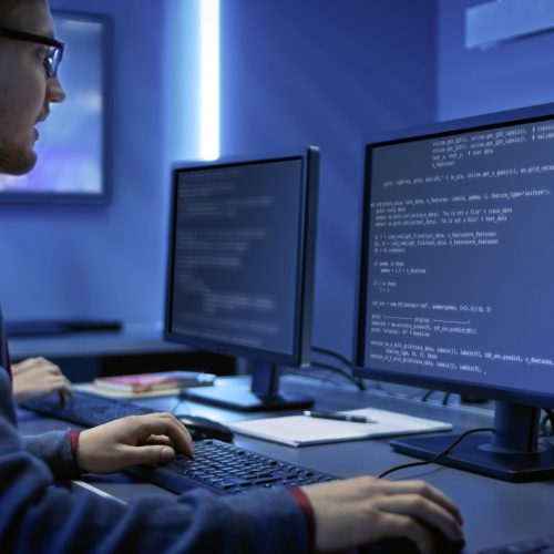 Smart Male IT Programer Working on Desktop Computer. Software Development / Code Writing / Website Design / Database Architecture. Technical Department Office.; Shutterstock ID 1590824893; Projektnummer: I07
